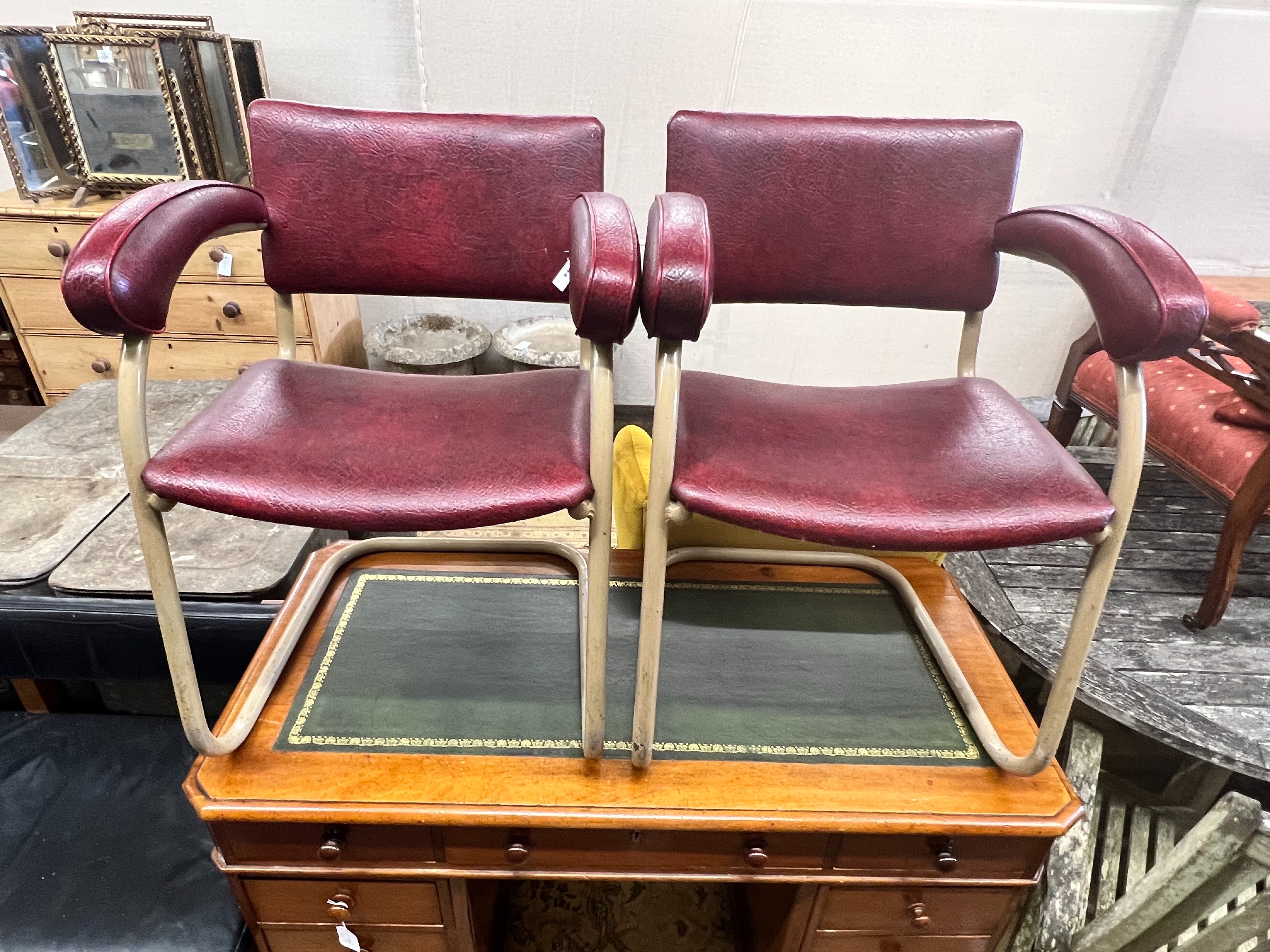 A pair of Pell elbow chairs, width 56cm depth 44cm height 78cm
